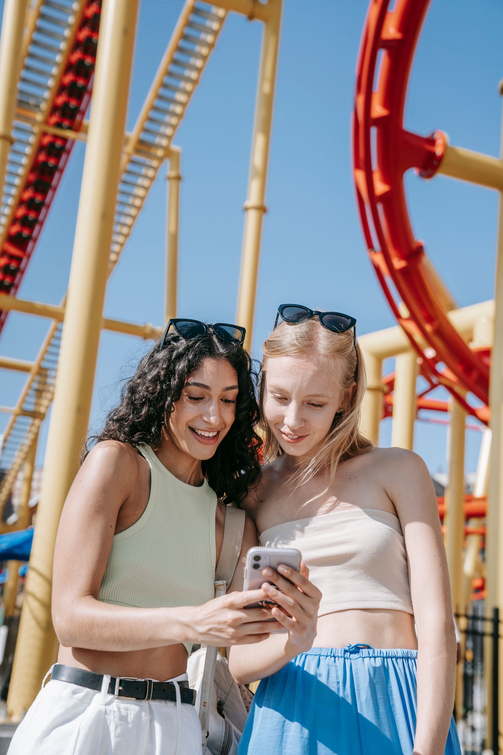 Two au pairs looking at the app together