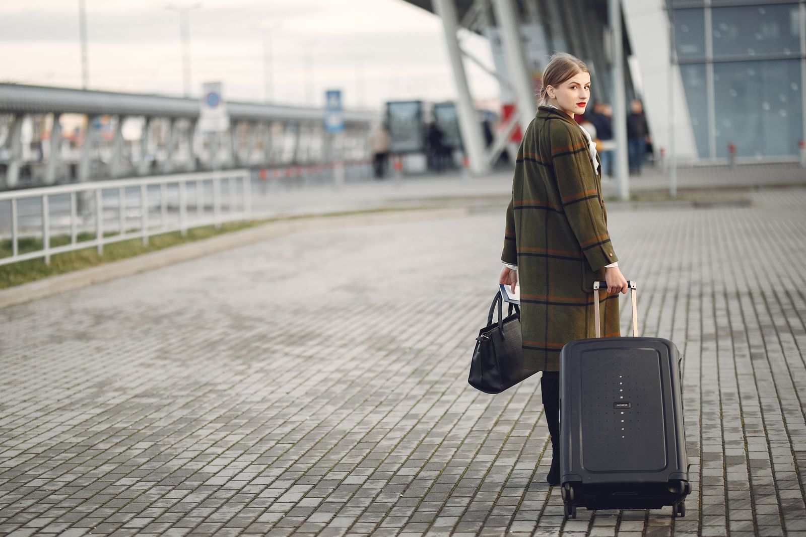 An au pair leaving with her luggage